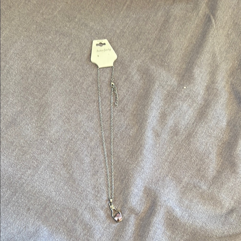 Silver necklace with pink heart